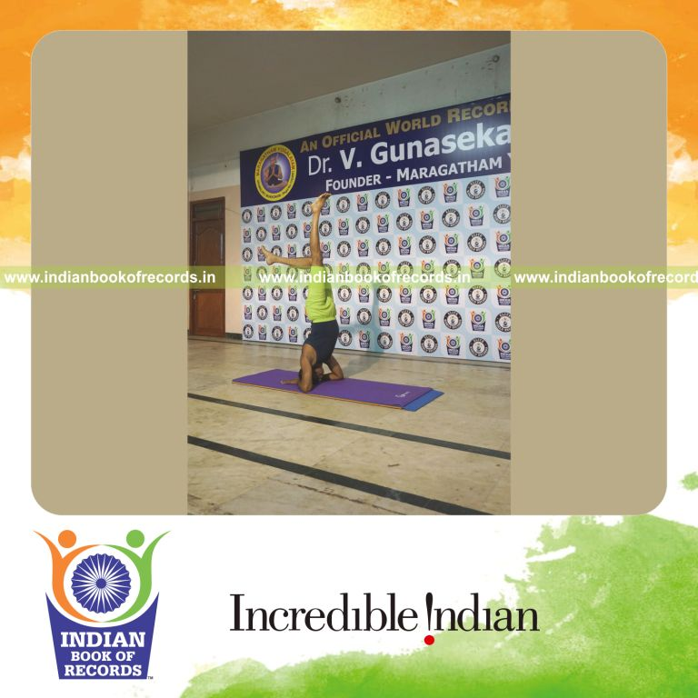 individual holding vama ekapada salamba sirsasana yoga pose blindfolded for record in Indian Book of Records