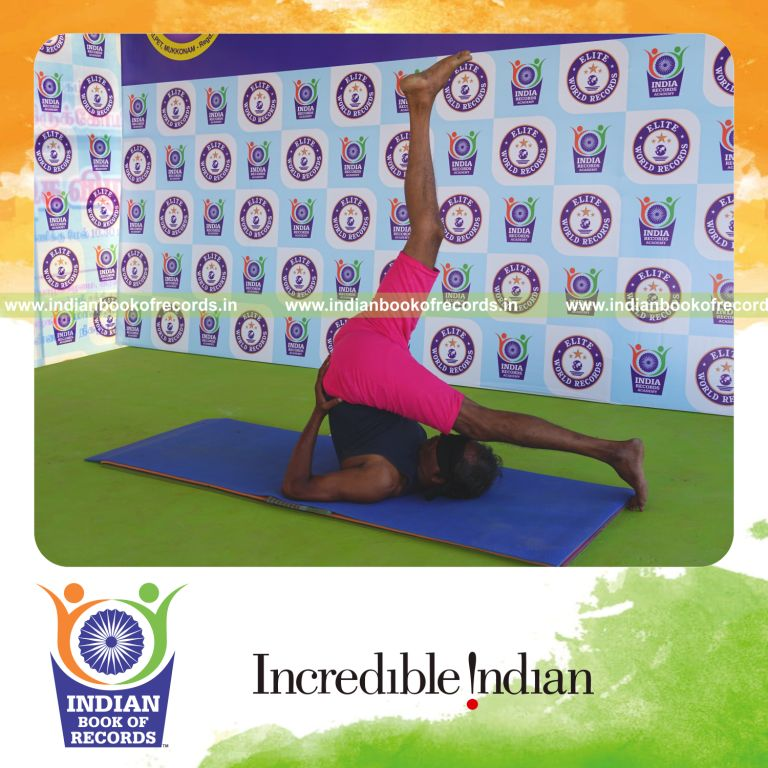 an individual holding vama ekapada sarvangasana yoga pose blindfolded for the longest duration with balance and stability for a record in Indian Book of Records