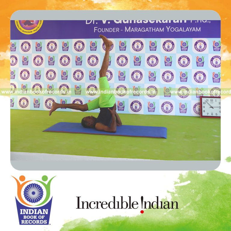 an individual holding vama ekapada sarvangasana yoga pose continuously for the longest duration with control and strength for a record in Indian Book of Records