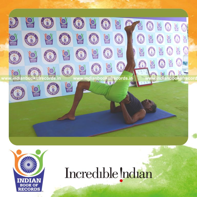 an individual holding vama ekapada setu bandha sarvangasana yoga pose continuously for the longest duration with balance and flexibility for a record in Indian Book of Records