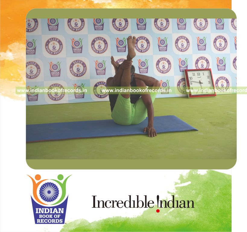 an individual holding vama ekapada sirasa krounchasana yoga pose blindfolded for the longest duration with flexibility and control for a record in Indian Book of Records