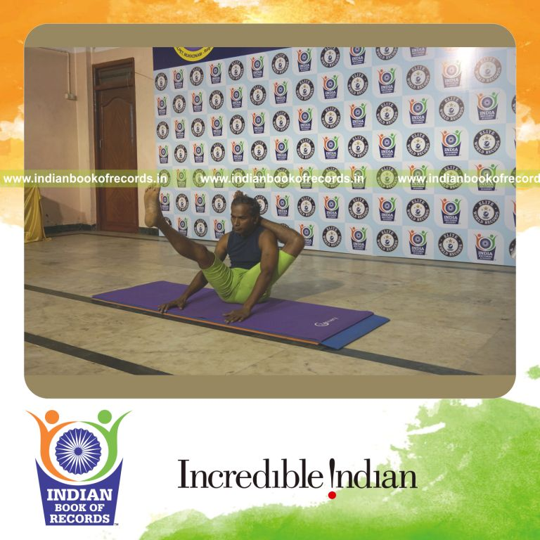 individual holding vama ekapada sirasa krounchasana yoga pose for record in Indian Book of Records