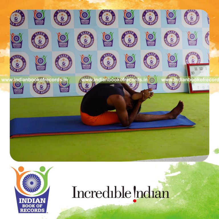 individual holding vama ekapada skandasana yoga pose blindfolded for record in Indian Book of Records