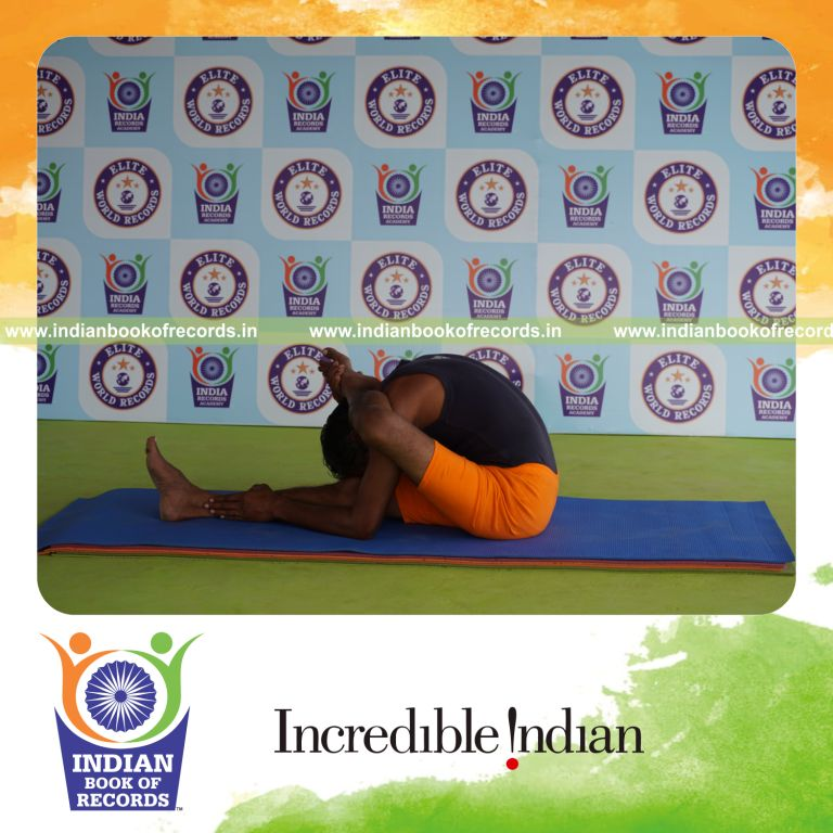 individual holding vama ekapada skandasana yoga pose for record in Indian Book of Records