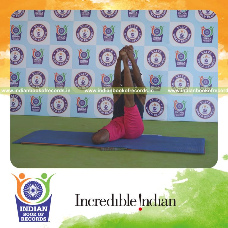 an individual holding vama gomukha krounchasana yoga pose blindfolded for the longest duration with flexibility and control for a record in Indian Book of Records