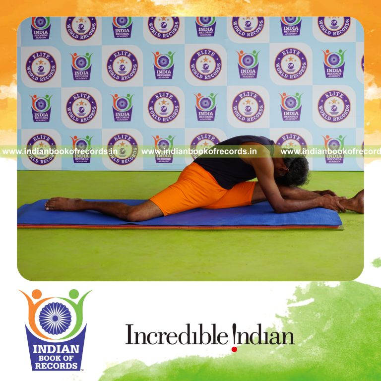 individual holding vama hanumana paschimottanasana yoga pose blindfolded for record in Indian Book of Records