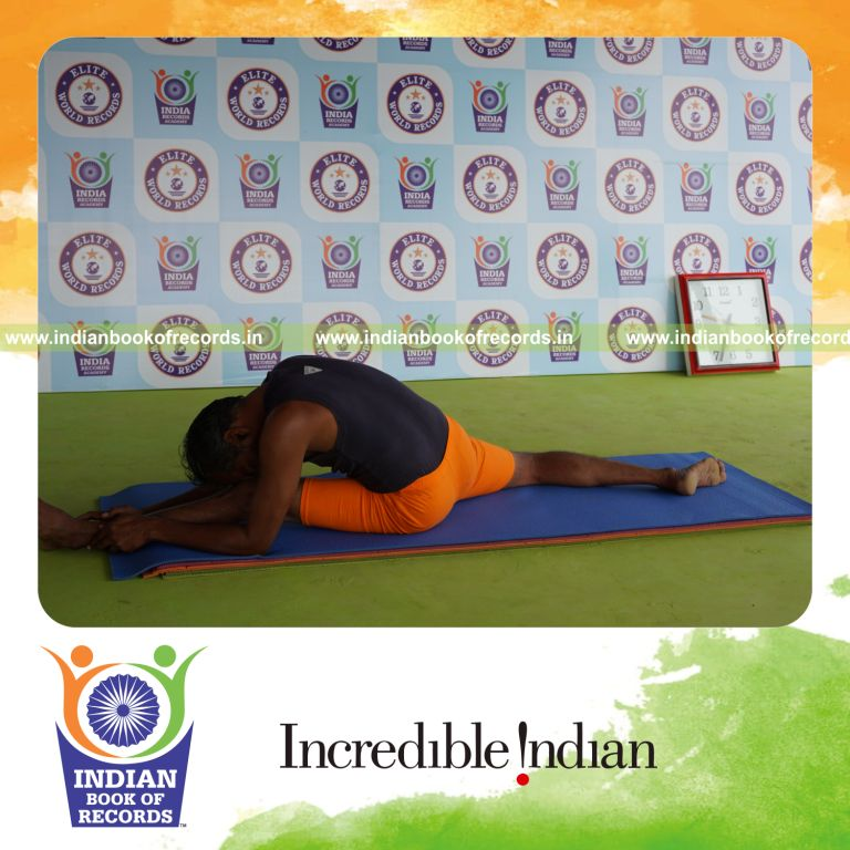 individual holding vama hanumana paschimottanasana yoga pose for record in Indian Book of Records