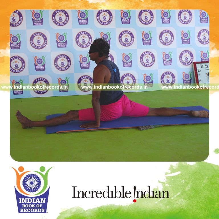 an individual holding vama hanumanasana yoga pose blindfolded for the longest duration with flexibility and balance for a record in Indian Book of Records