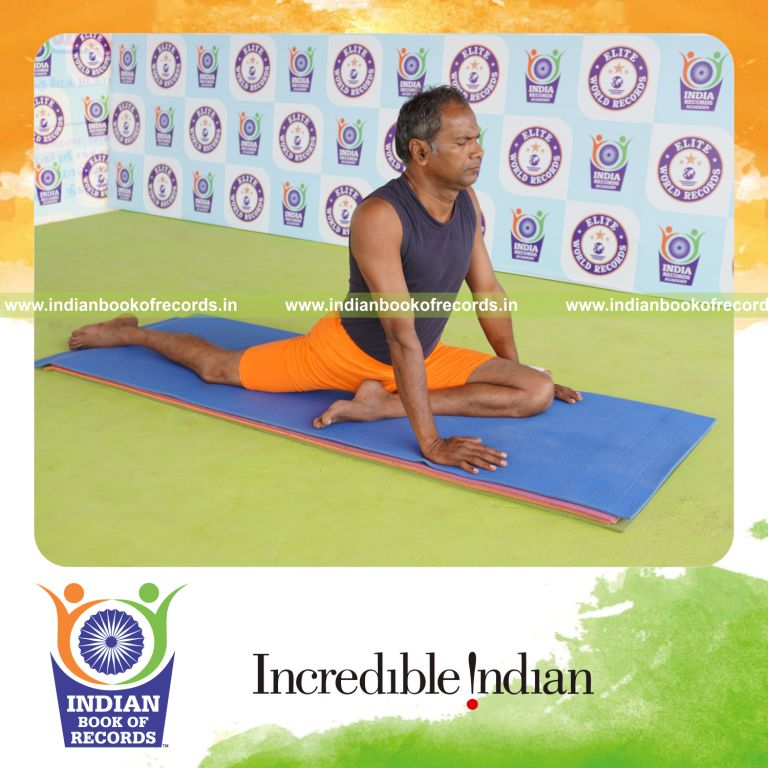 individual holding vama janu bhujangasana yoga pose for record in Indian Book of Records