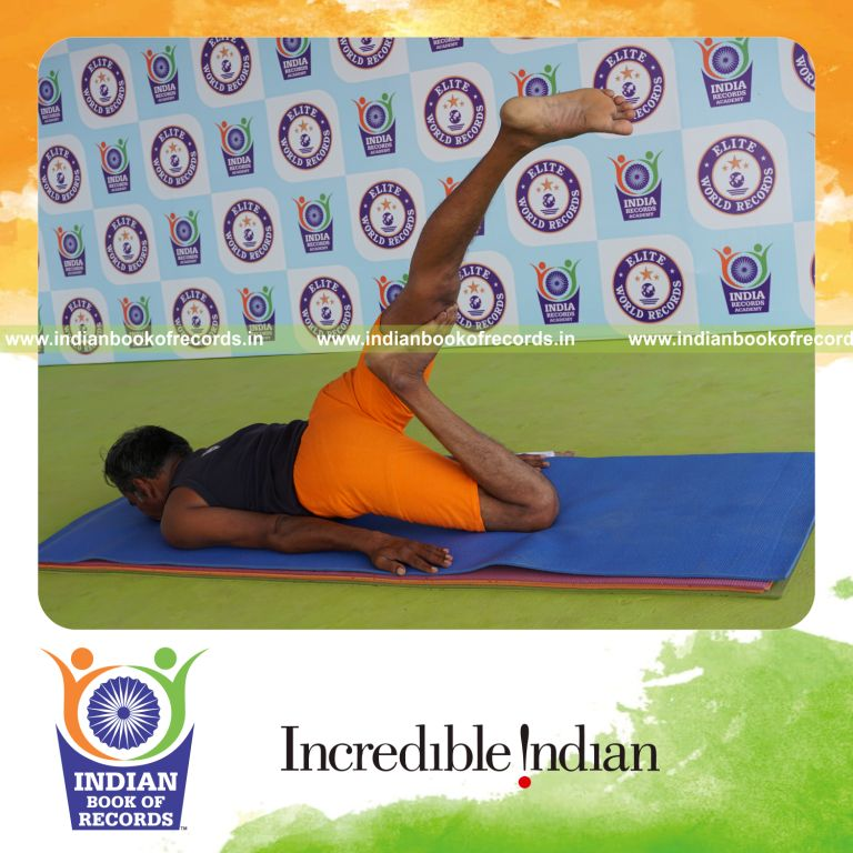individual holding vama janu salabhasana yoga pose for record in Indian Book of Records