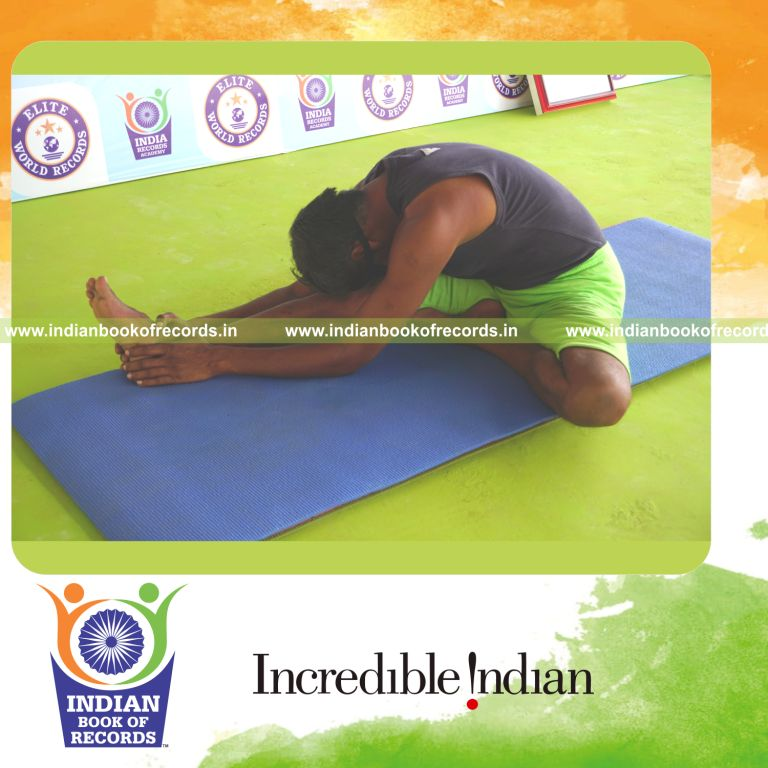 an individual holding vama janu sirsasana yoga pose blindfolded for the longest duration with flexibility and control for a record in Indian Book of Records