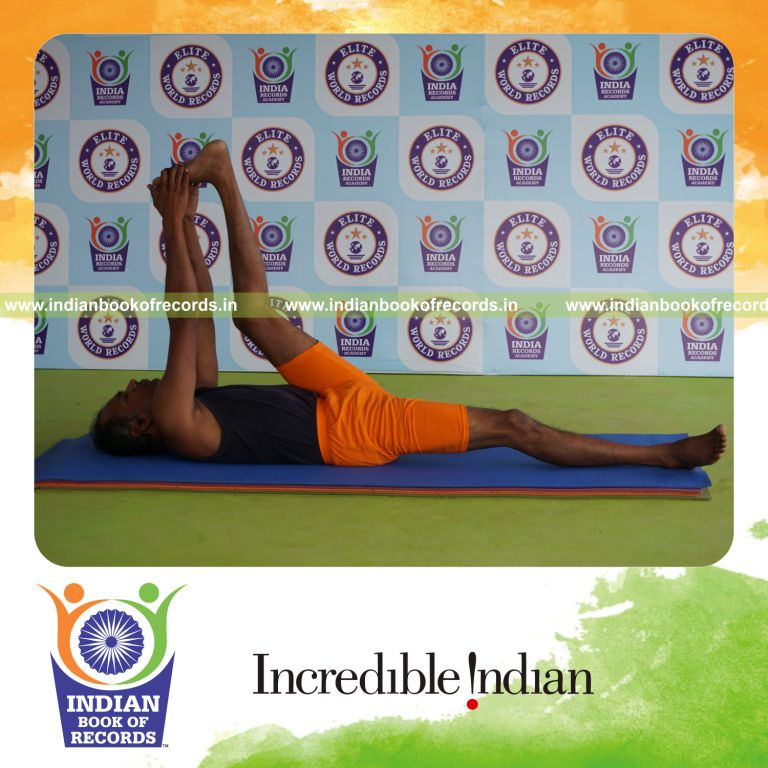individual holding vama julasana yoga pose for record in Indian Book of Records