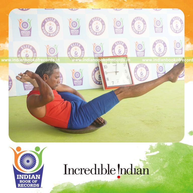 individual holding vama kala bhairavasana yoga pose on a brass plate for record in Indian Book of Records