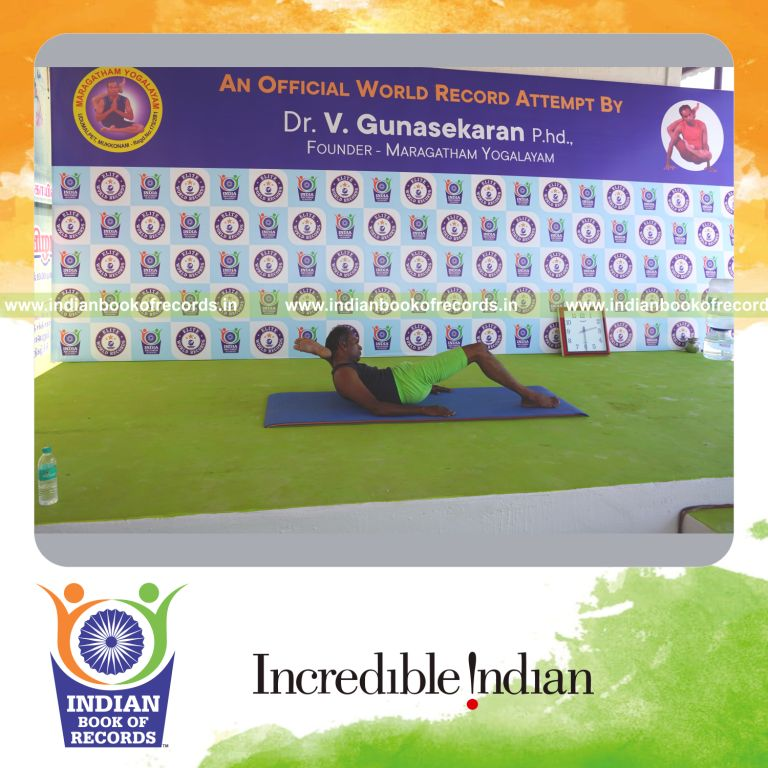an individual holding vama kala bhairavasana yoga pose continuously for the longest duration with stability and control for a record in Indian Book of Records