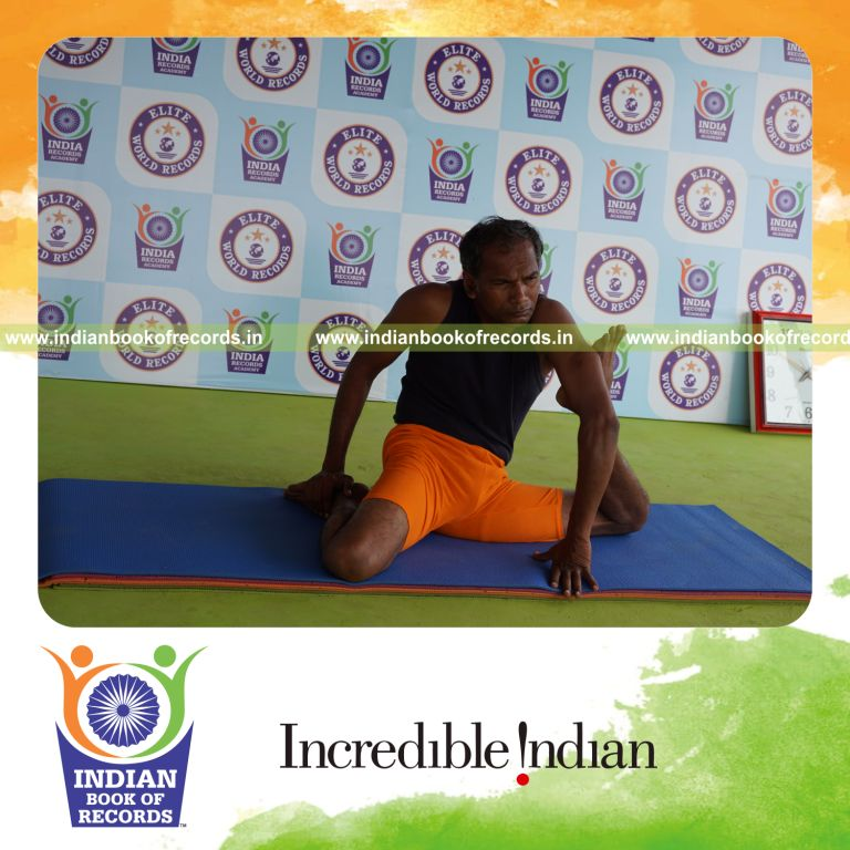 individual holding vama mrigasana yoga pose for record in Indian Book of Records