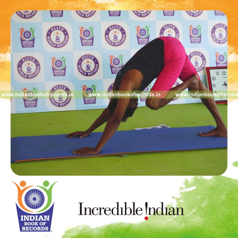 individual holding vama nasika purusta janu parsvasana yoga pose blindfolded for record in Indian Book of Records