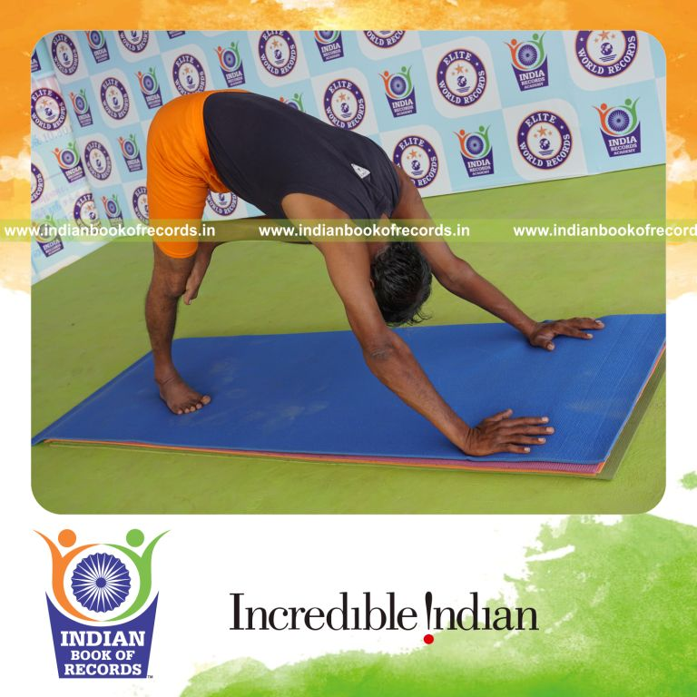 individual holding vama nasika purusta janu parsvasana yoga pose for record in Indian Book of Records