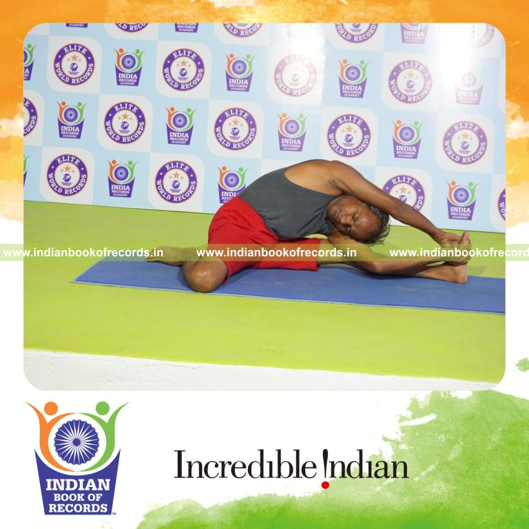 individual holding vama parivrtta gomukha janu sirsasana yoga pose for record in Indian Book of Records
