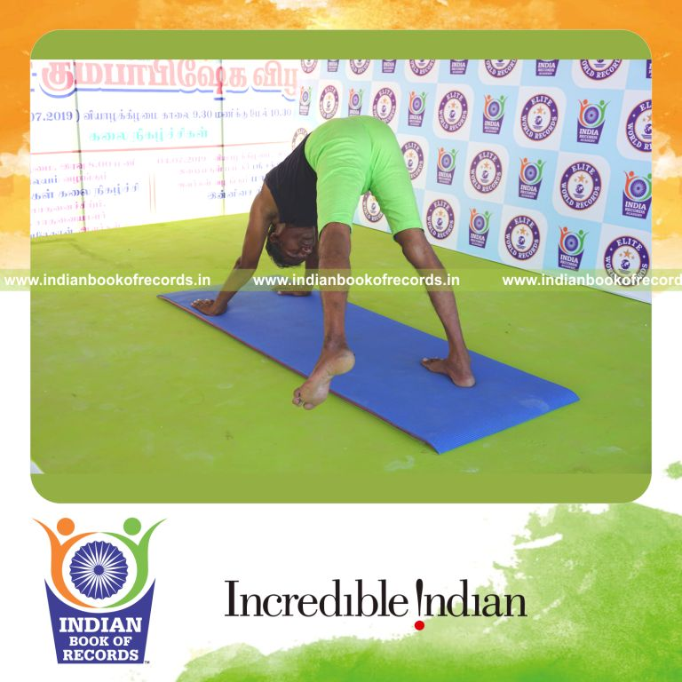 an individual holding vama parsva ekapada adho mukha svanasana yoga pose continuously for the longest duration with balance and flexibility for a record in Indian Book of Records