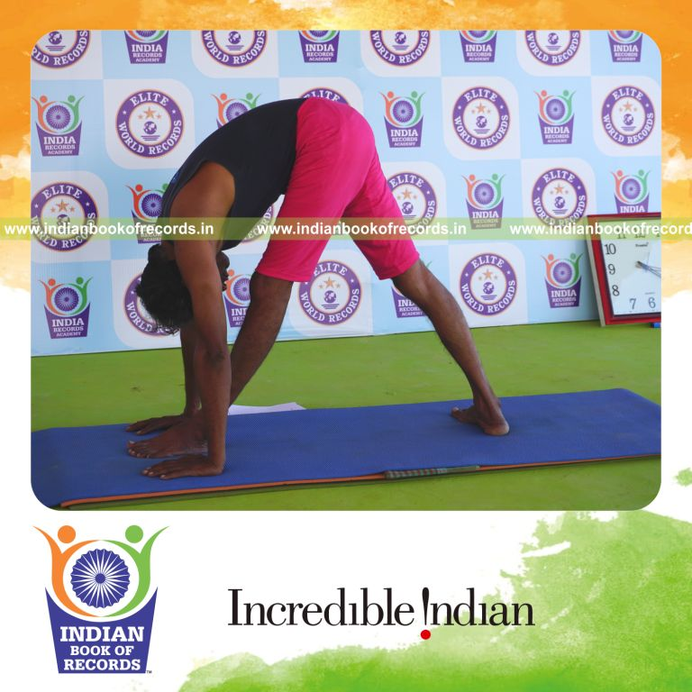 an individual holding vama parsvottanasana yoga pose blindfolded for the longest duration with flexibility and balance for a record in Indian Book of Records