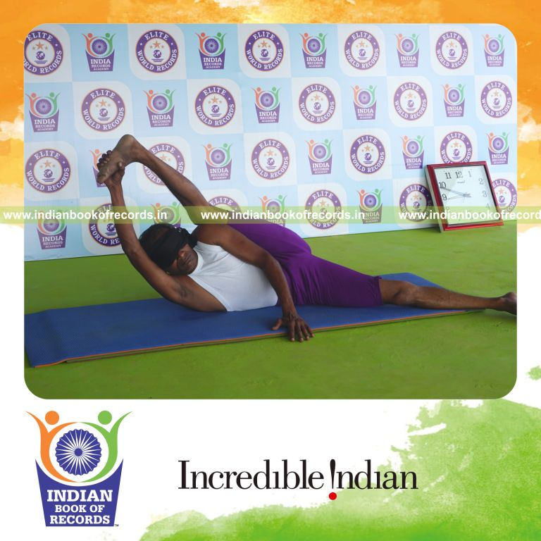 individual holding vama purna anandasana yoga pose blindfolded for record in Indian Book of Records