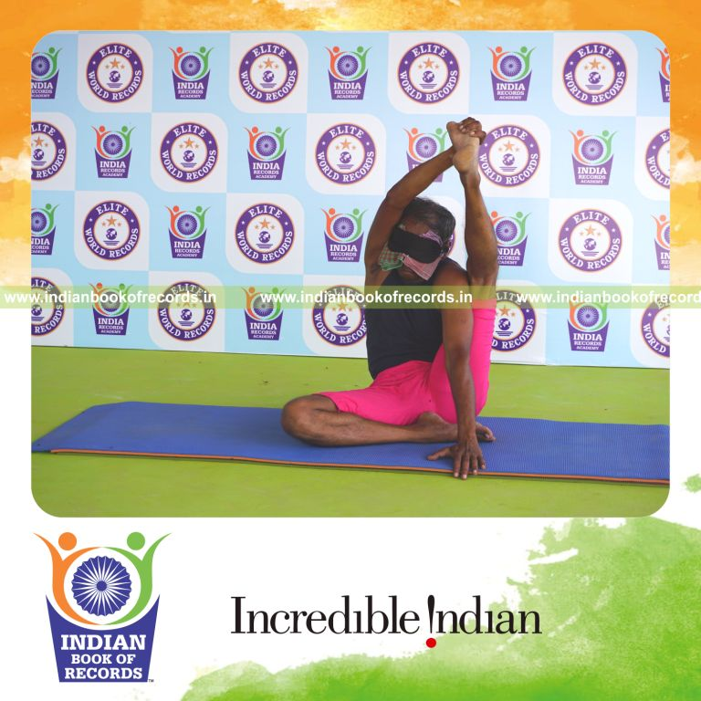 an individual holding vama purna krounchasana yoga pose blindfolded for the longest duration with flexibility and control for a record in Indian Book of Records