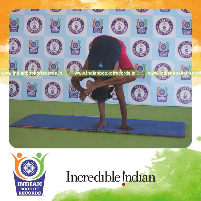 an individual holding vama ruchikasana yoga pose blindfolded for the longest duration with flexibility and control for a record in Indian Book of Records