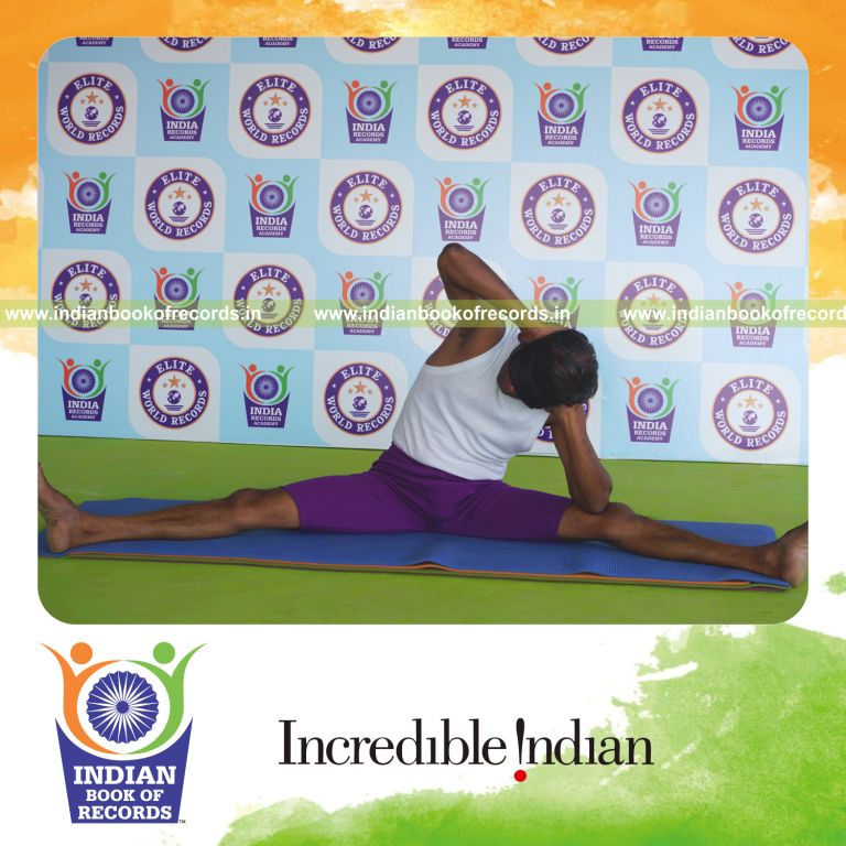 individual holding vama upavista seerasana yoga pose blindfolded for record in Indian Book of Records