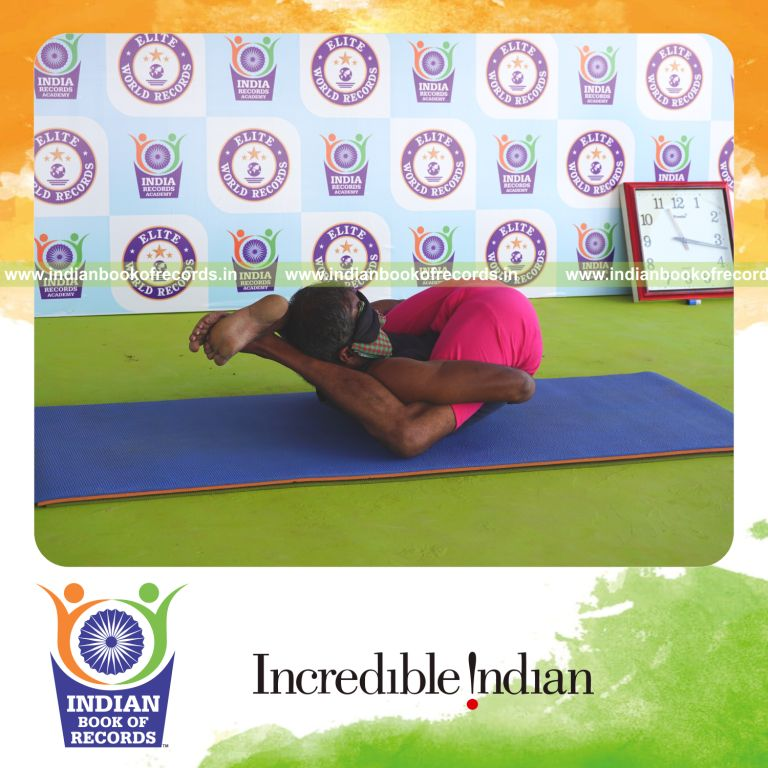 an individual holding yoganidrasana yoga pose blindfolded for the longest duration with flexibility and control for a record in Indian Book of Records