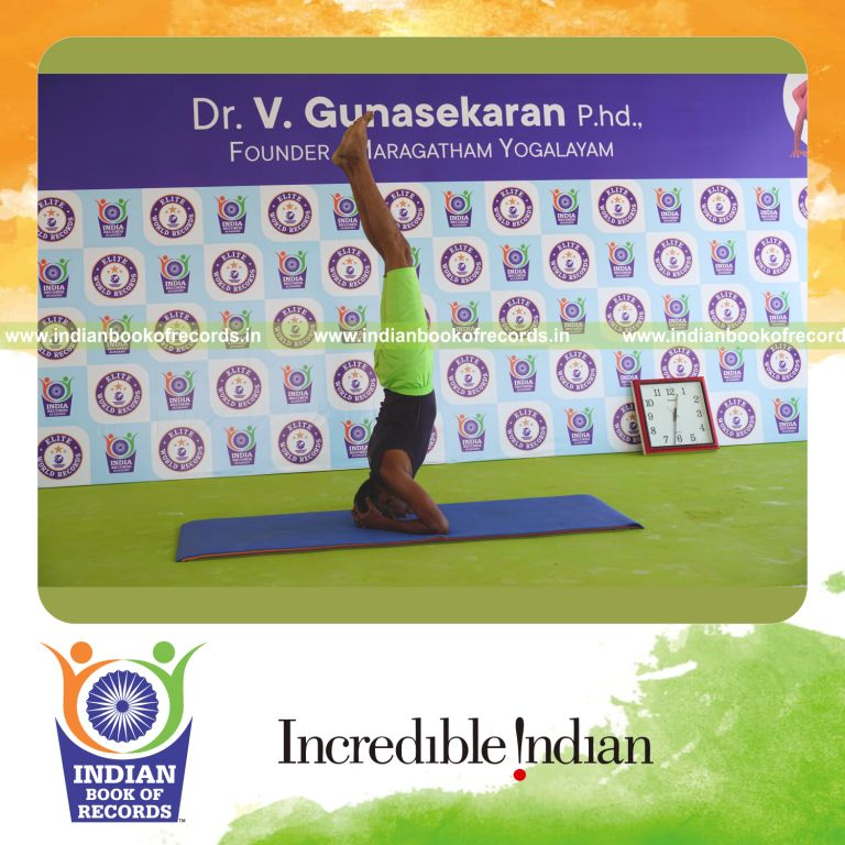 an individual holding the sirsasana yoga pose continuously for the longest duration with balance and control for a record in Indian Book of Records