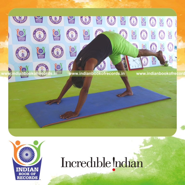 an individual holding the vama ekapada adho mukha svanasana yoga pose continuously for the longest duration with control for a record in Indian Book of Records