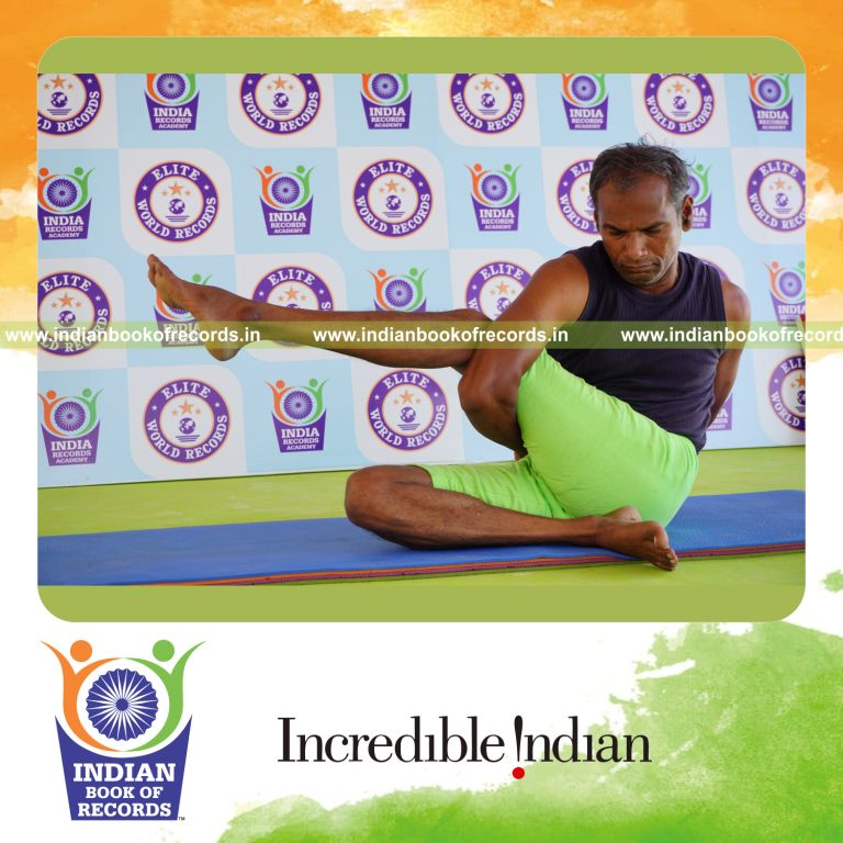an individual holding the vama parivrtta ardha matsyendrasana yoga pose continuously for the longest duration with stability for a record in Indian Book of Records