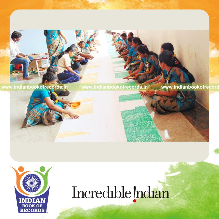 team creating long indian national flag using thumbprints for Indian Book of Records