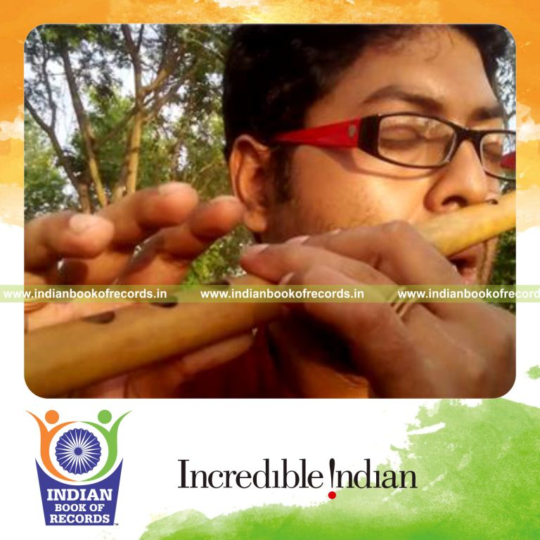 individual playing flute with nose for longest time for record in Indian Book of Records