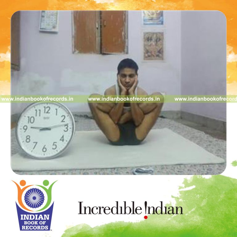 individual holding foetus yoga pose for longest duration for record in Indian Book of Records