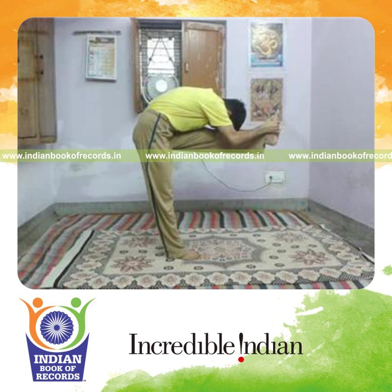 individual holding forehead to knee pose on one leg for record in Indian Book of Records