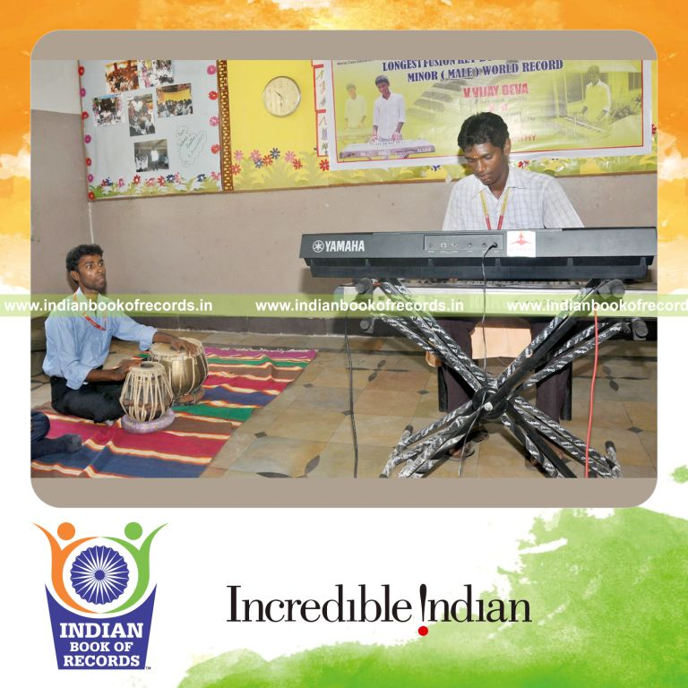 young male performing fusion keyboard concert for record in Indian Book of Records