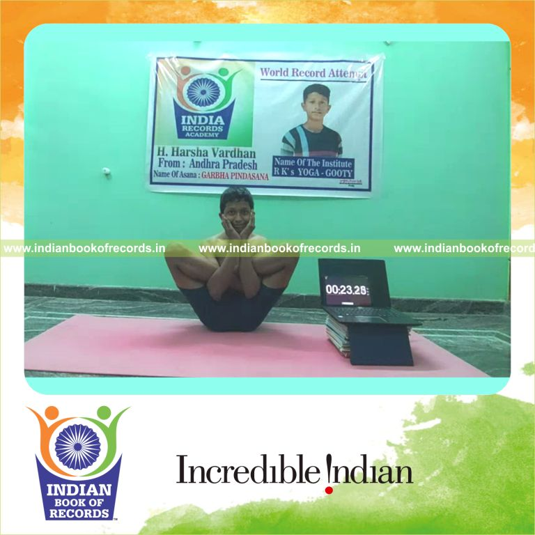 A participant maintaining the Garbha Pindasana yoga pose steadily for a long duration recognized by Indian Book of Records