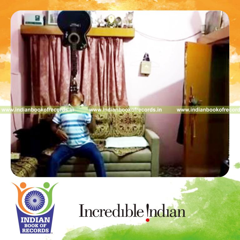 individual balancing guitar on chin while seated for longest time for record in Indian Book of Records