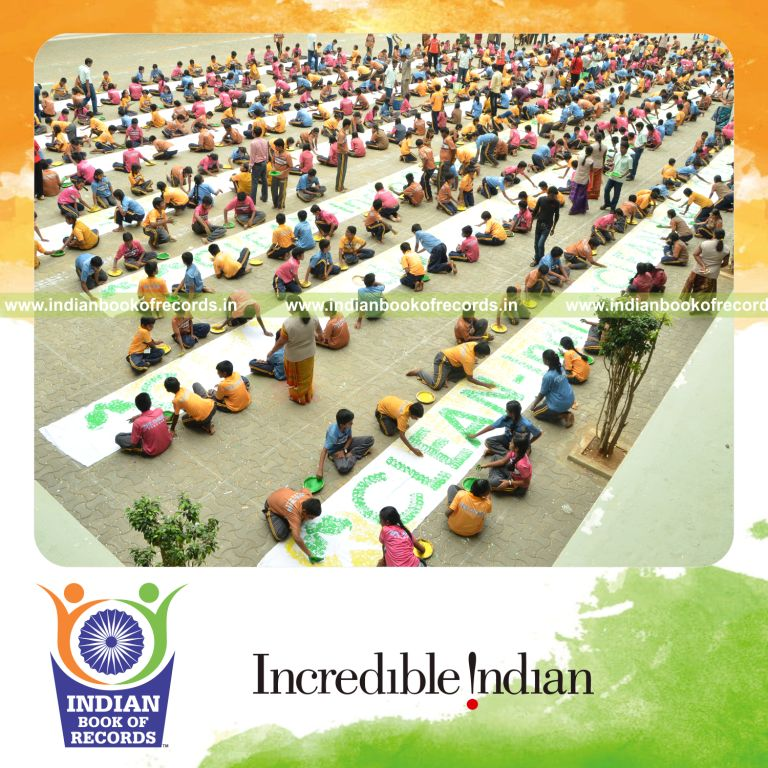 team creating large handprint painting artwork for Indian Book of Records