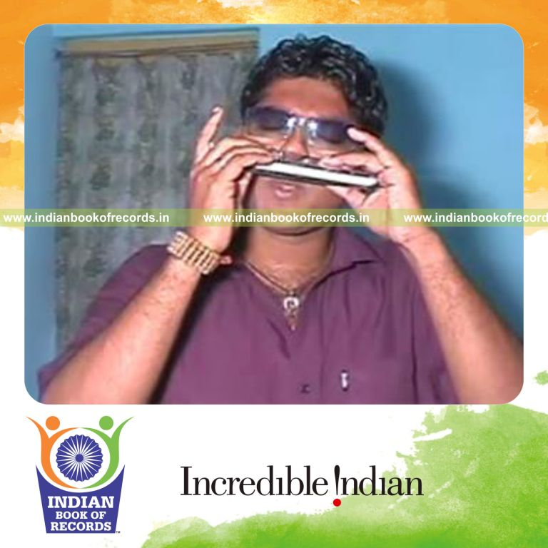 individual playing harmonica with nose for longest time for record in Indian Book of Records