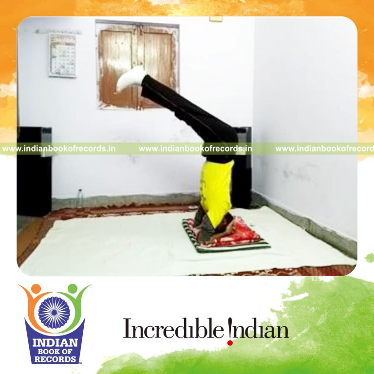 individual performing headstand with legs bent at right angle for longest time for record in Indian Book of Records