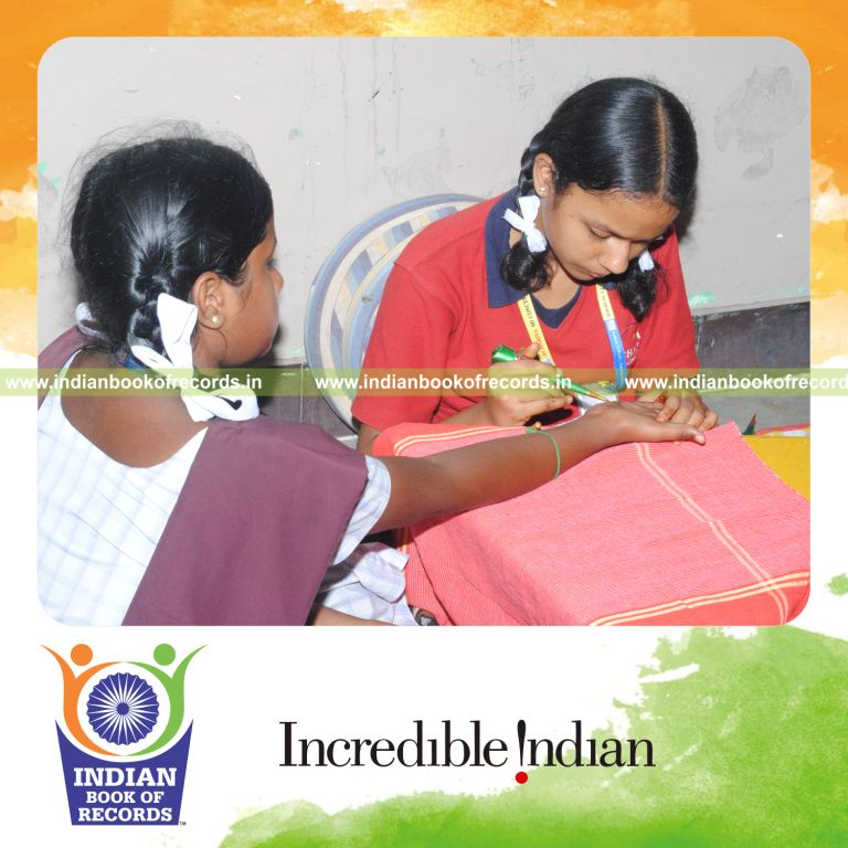 young female performing henna art marathon for extended duration for record in Indian Book of Records