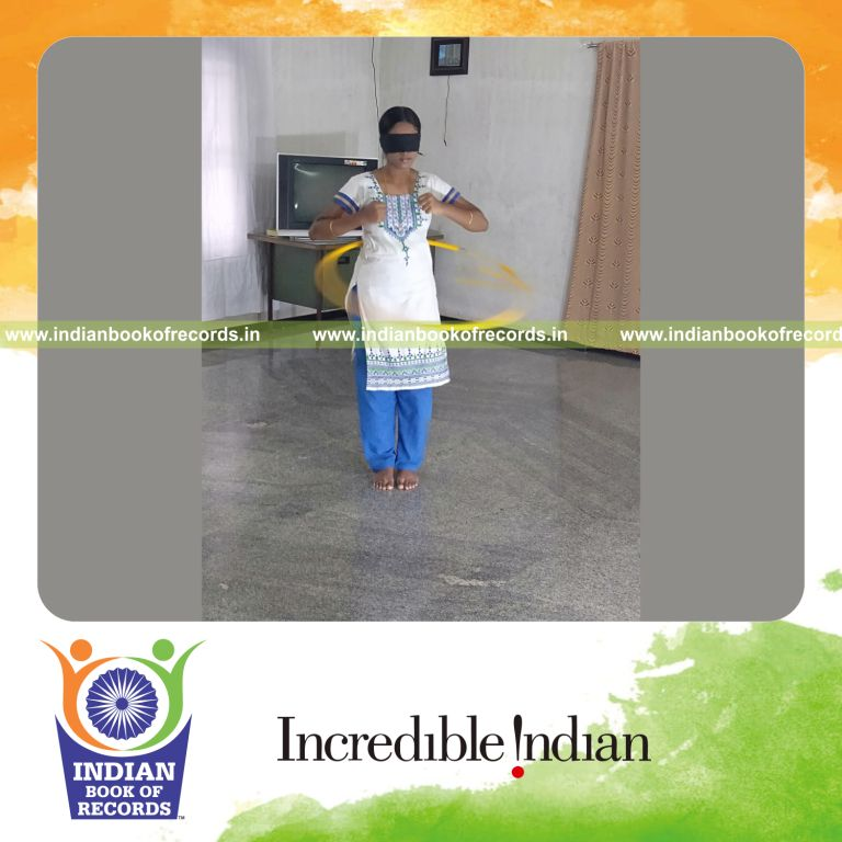 individual female performing hula hoop blindfolded for longest duration for record in Indian Book of Records