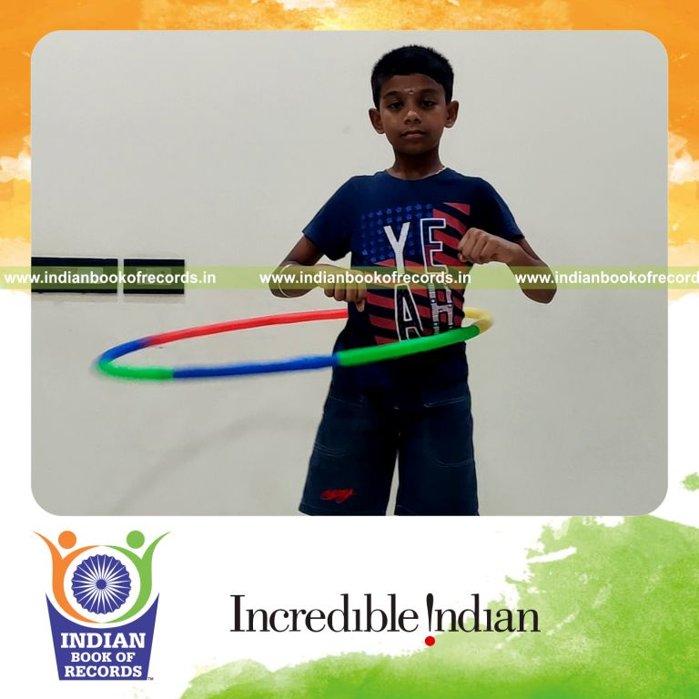 minor male performing hula hoop for longest duration for record in Indian Book of Records