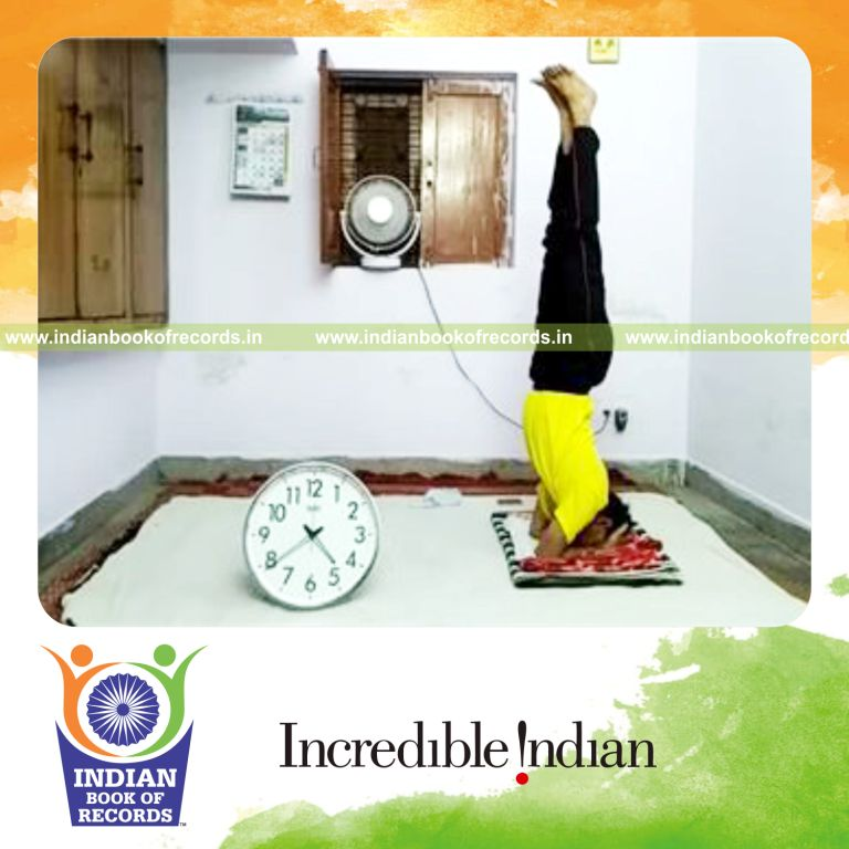 individual performing indoor headstand for longest time for record in Indian Book of Records