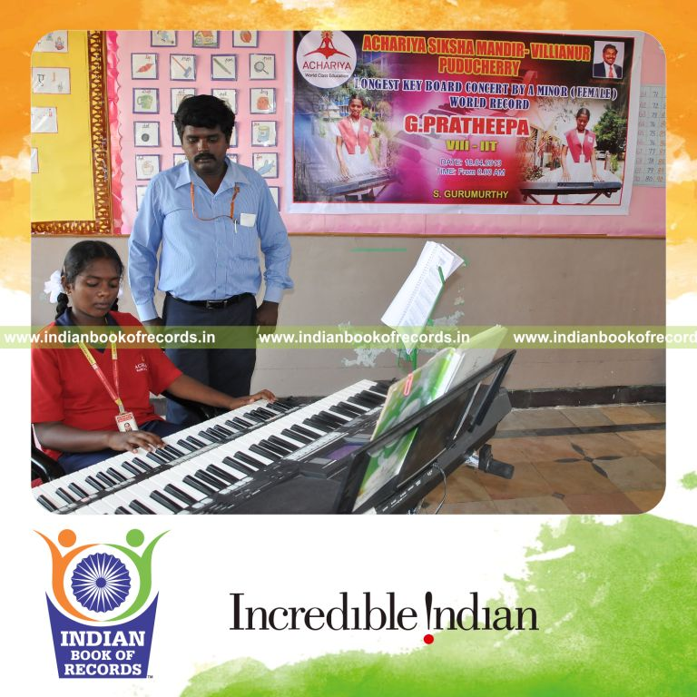 young female performing extended keyboard concert for record in Indian Book of Records
