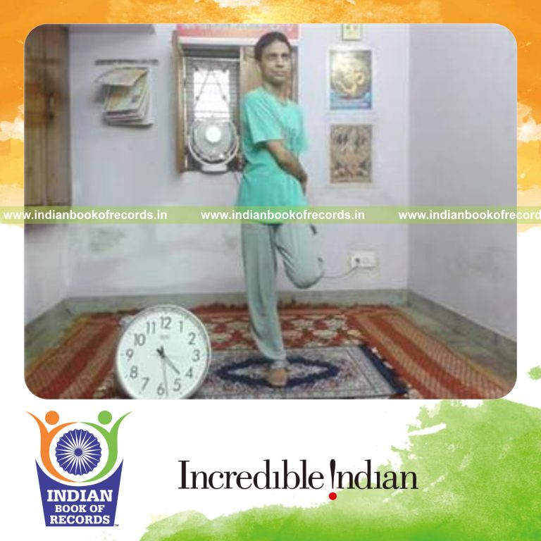 individual bending knee and holding foot with one hand for longest time for record in Indian Book of Records