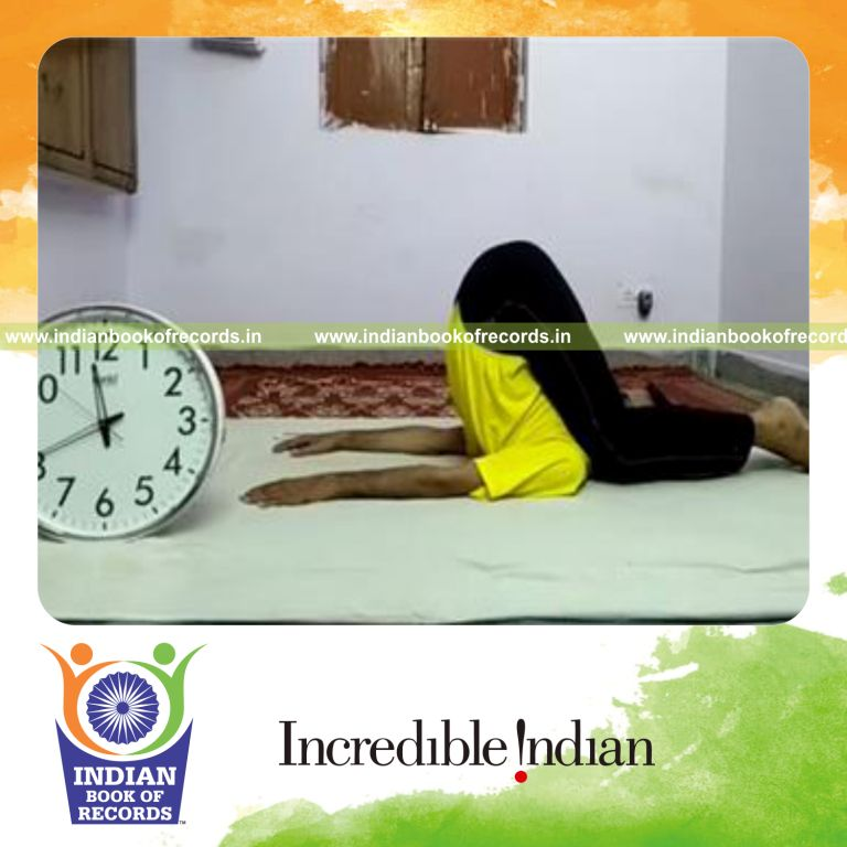 individual holding knee to ear yoga pose for longest duration for record in Indian Book of Records