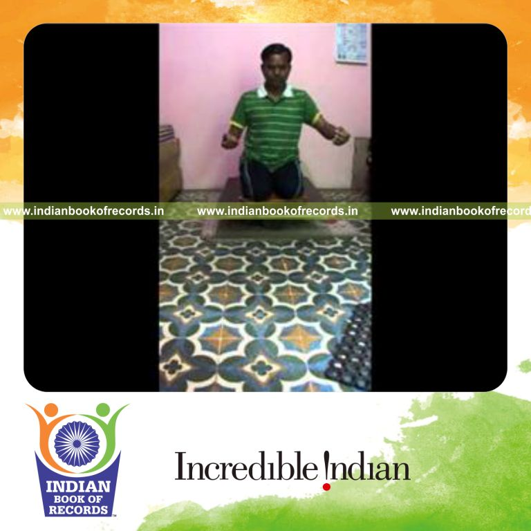 individual kneeling on balance board for record in Indian Book of Records